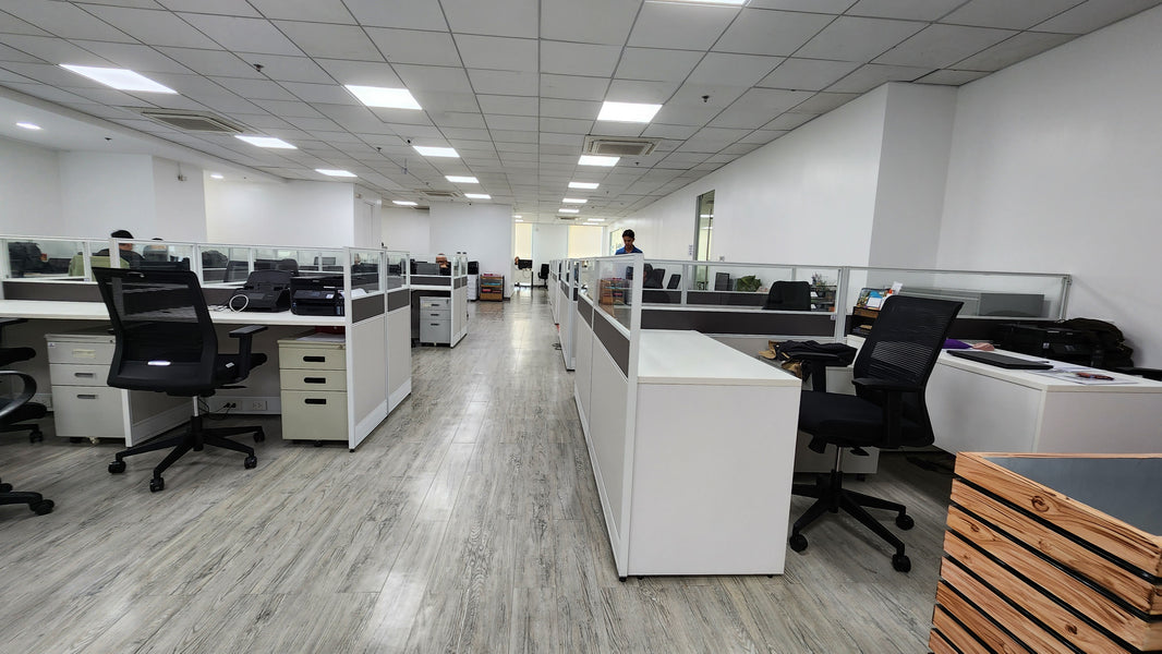 an image shows black mesh ergonomic chairs by rocco workspace solutions in manila philippines with desks, workstations and cubicles