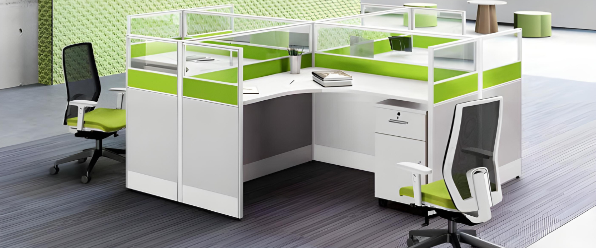 A modern office workspace featuring an L-shaped workstation with glass partitions for privacy.