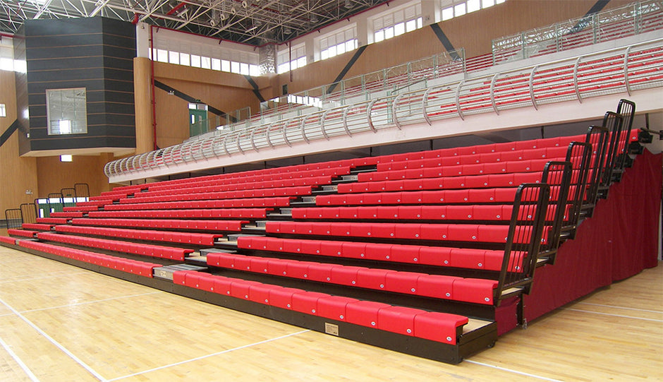 red gym bleachers inside a university gym