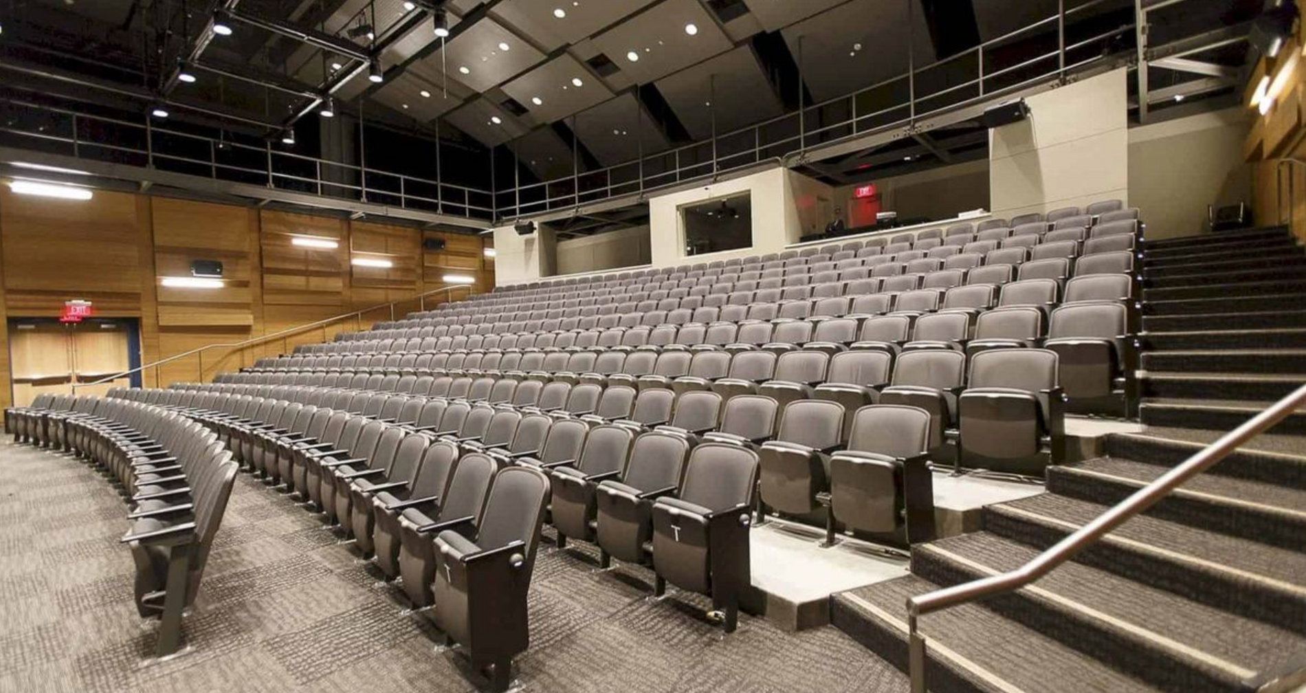 row of cinema chairs on black fabric