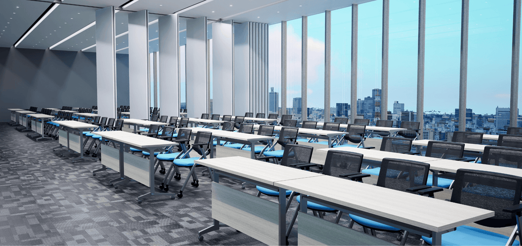 A room with operable partition wall in the Philippines used in a huge meeting space with tall glass windows overlooking the city skyline.