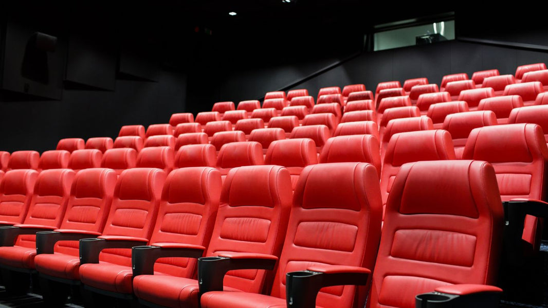 A wide-angle shot of rows of red theater seats