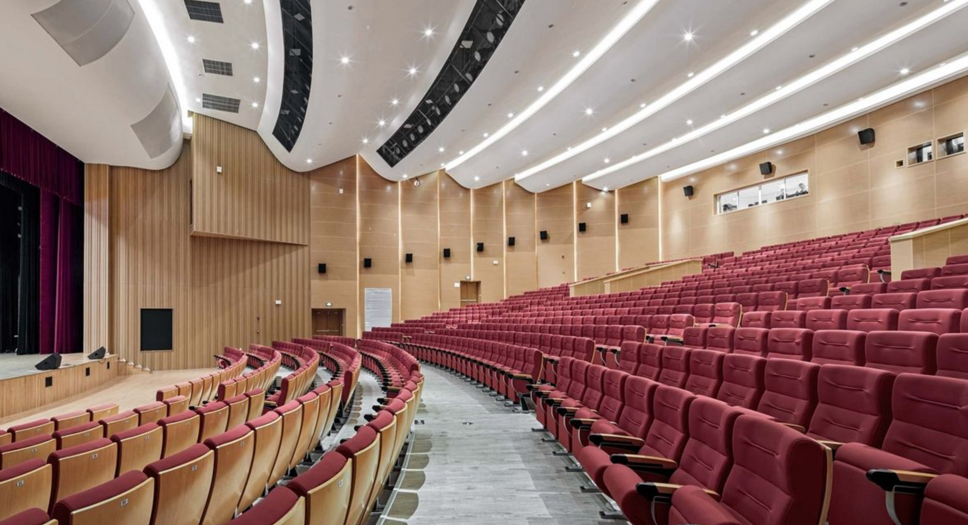 red velvet movie theater seats in w well lit room