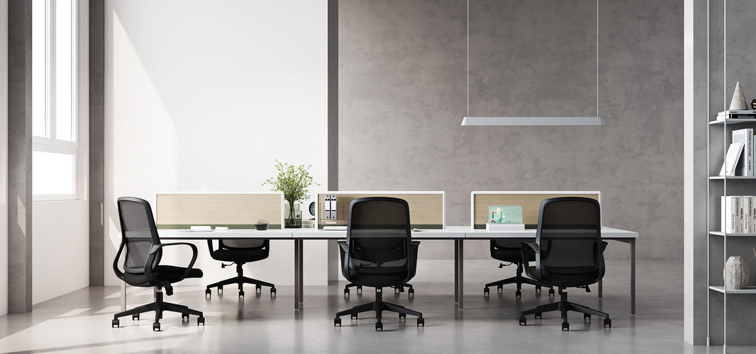 office swivel chairs in black mesh with desks in a workspace in the Philippines