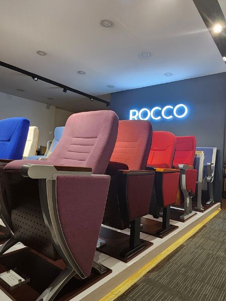 cinema seats, concert hall chairs and auditorium seats in a showroom display with rocco logo